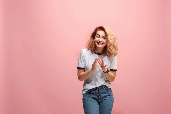 The happy business woman standing and smiling against pink background. — Stock Photo, Image