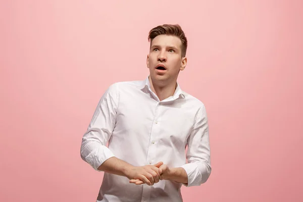 Portrait of the scared man on pink — Stock Photo, Image