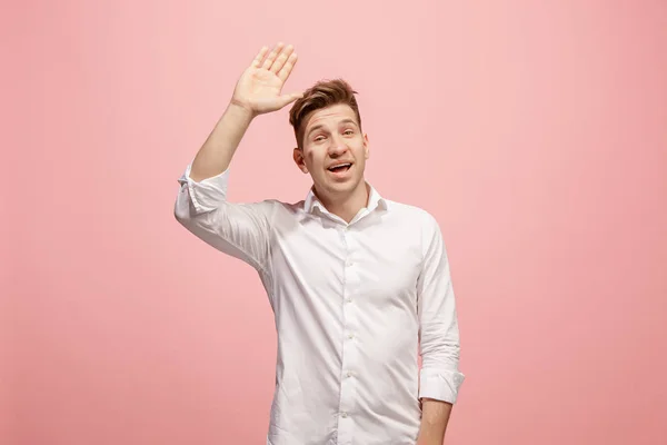 Isolated on pink young casual man shouting at studio — Stock Photo, Image