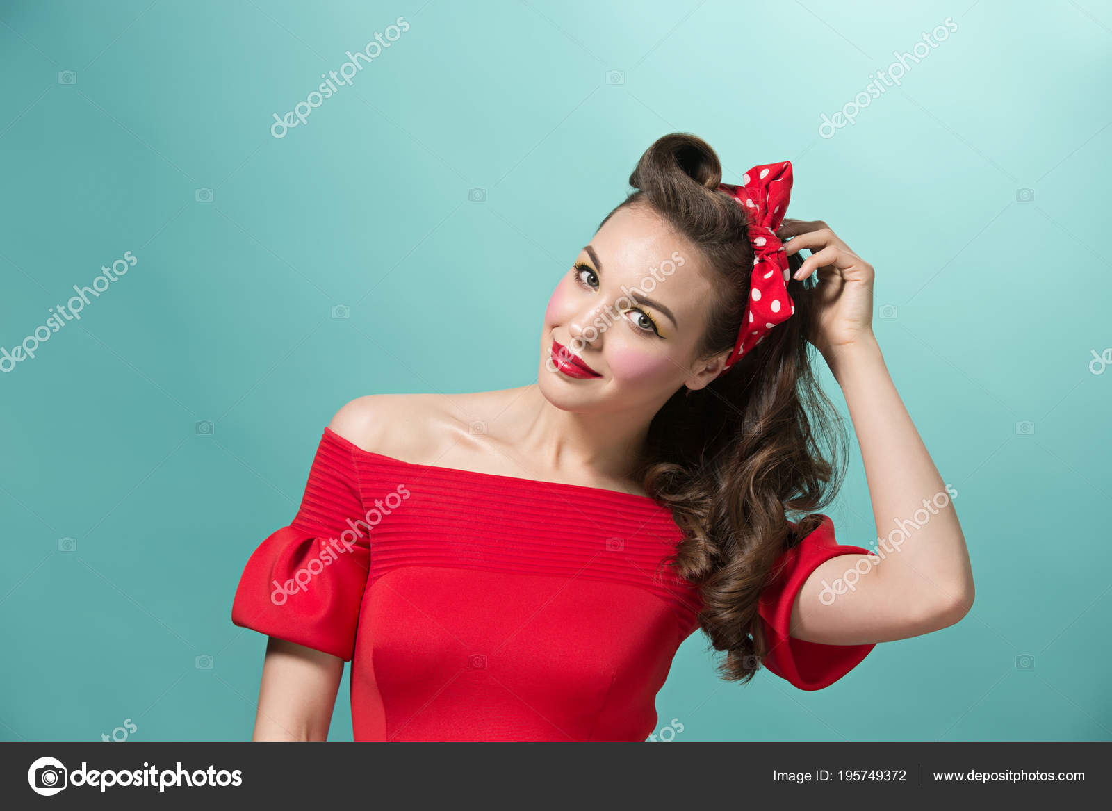 Beautiful Young Woman With Pinup Make Up And Hairstyle Studio