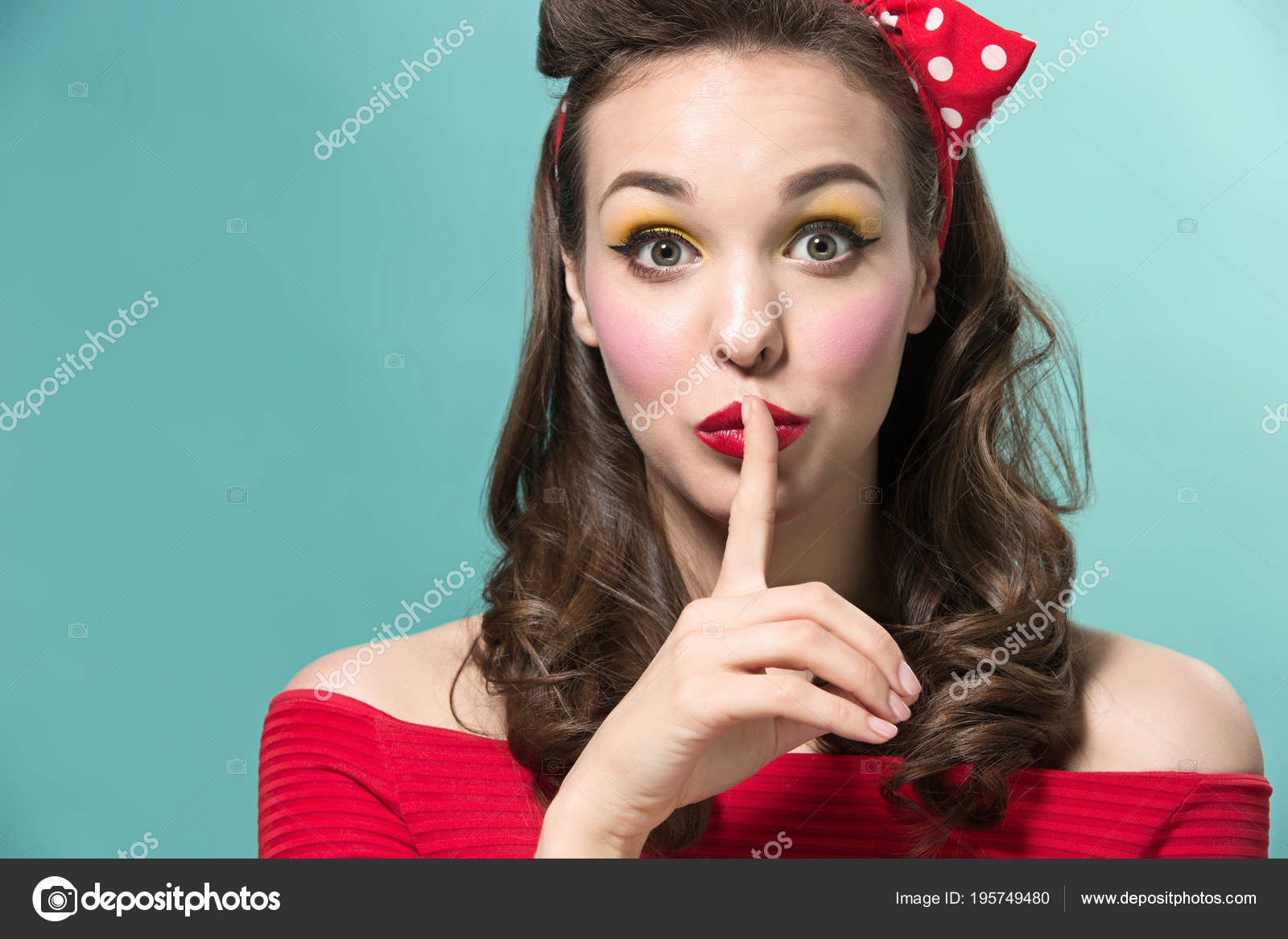 Beautiful Young Woman With Pinup Make Up And Hairstyle Studio