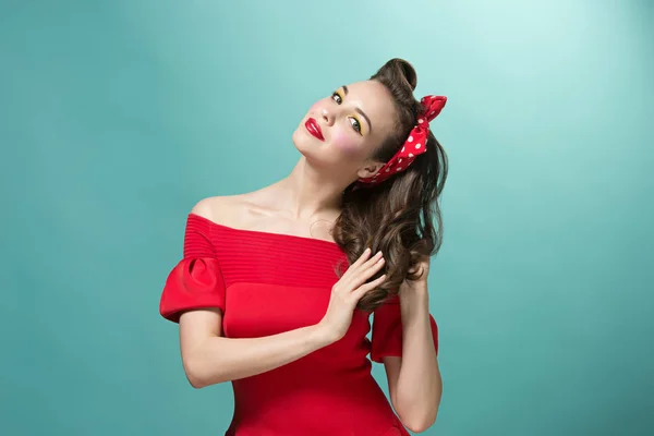 Beautiful young woman with pinup make-up and hairstyle. Studio shot on white background — Stock Photo, Image