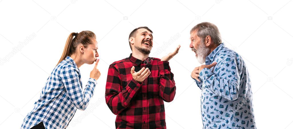 Family members arguing with one another on white studio background.