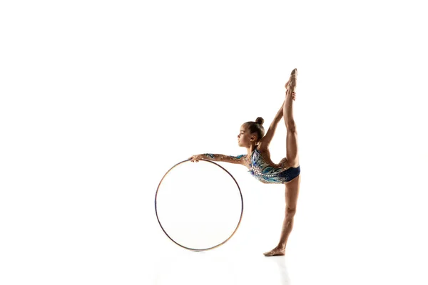 Little flexible female gymnast isolated on white studio background — Stock Photo, Image