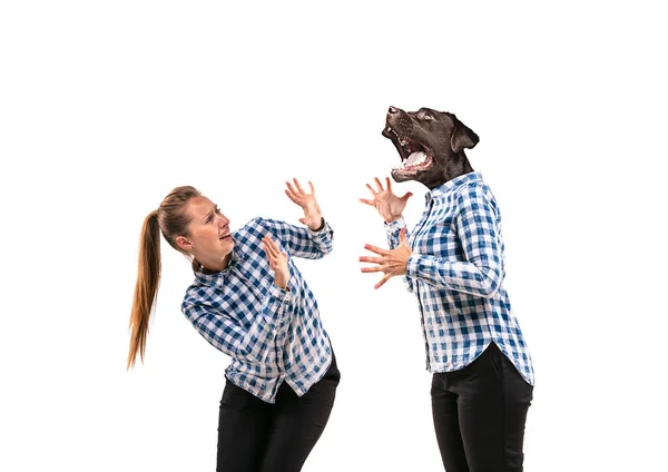 Young handsome woman arguing with herself as a dog on white studio background. — Stock Photo, Image