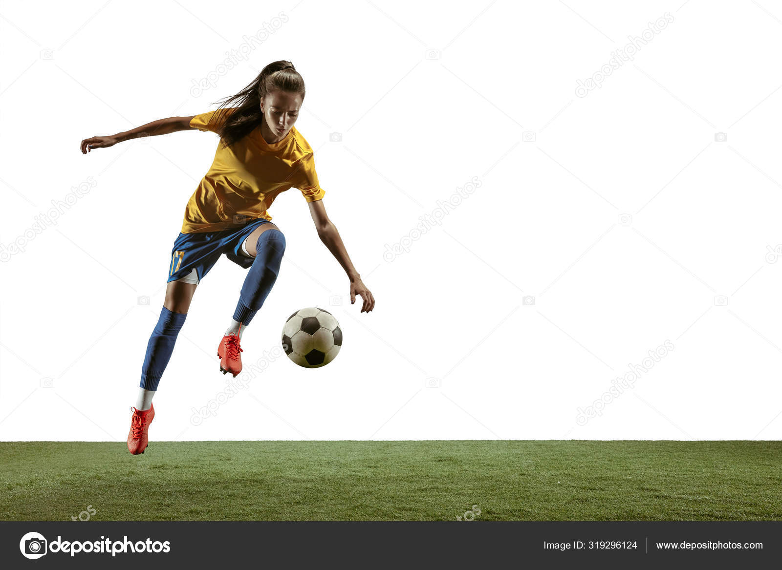 pro soccer player kicking ball