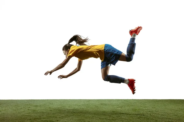 Female soccer player kicking ball at the stadium — Stock Photo, Image