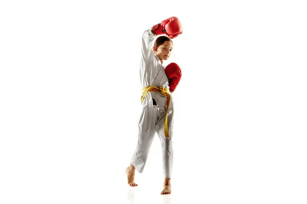 Confident junior in kimono practicing hand-to-hand combat, martial arts — Stock Photo, Image