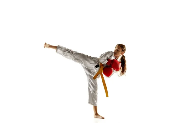 Confident junior in kimono practicing hand-to-hand combat, martial arts — Stock Photo, Image