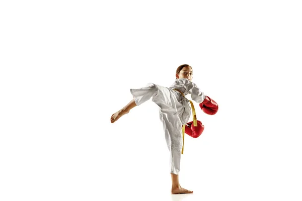 Confident junior in kimono practicing hand-to-hand combat, martial arts — Stock Photo, Image