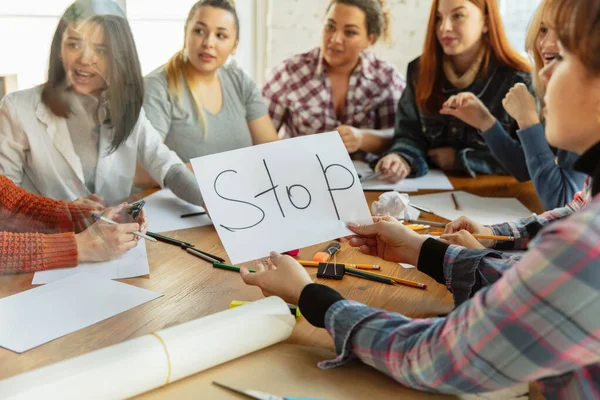 Young people discussing about women rights and equality at the office — Stock Photo, Image