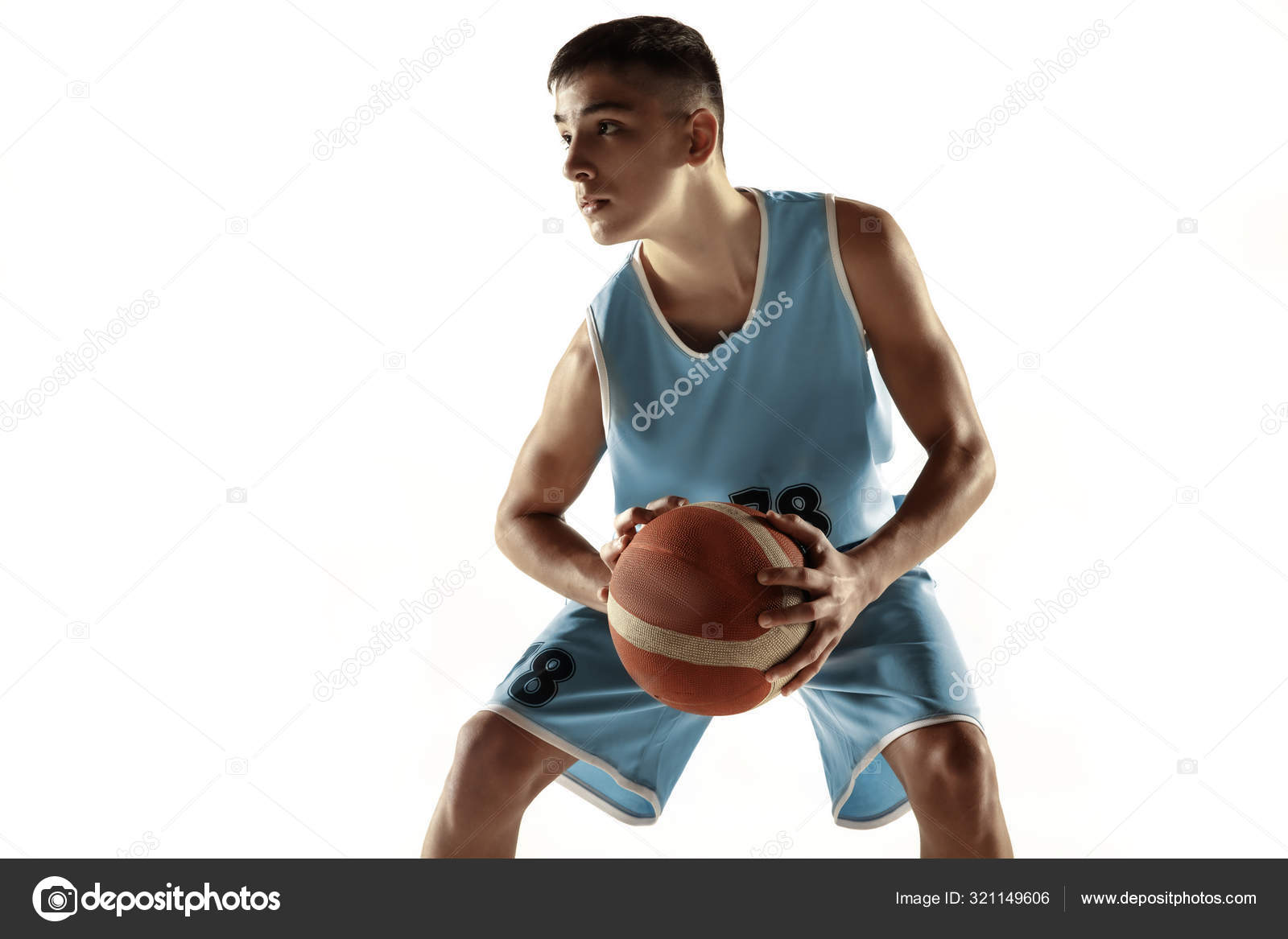 Basketball player in action isolated on white background Stock
