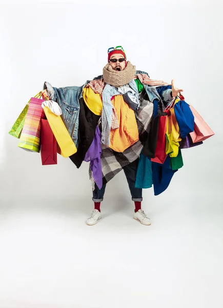Man addicted of sales and clothes, overproduction and crazy demand — Stock Photo, Image