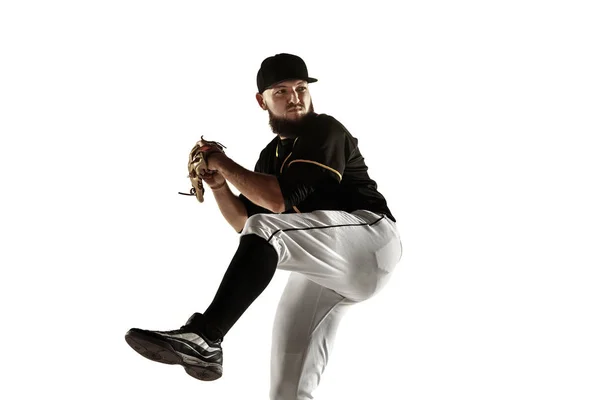 Baseball player, pitcher in a black uniform practicing on a white background. — Stock Photo, Image