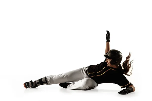 Baseball spelare, kastare i svart uniform öva på en vit bakgrund. — Stockfoto