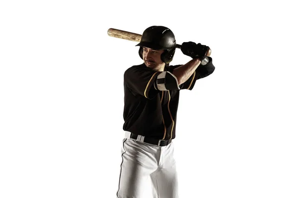 Baseball player, pitcher in a black uniform practicing on a white background. — Stock Photo, Image