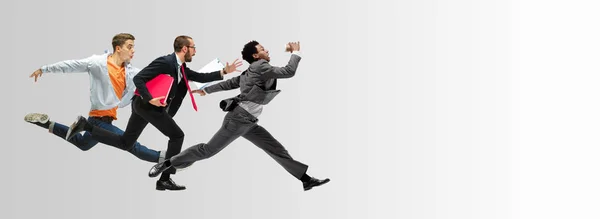 Office workers or ballet dancers jumping on white background — Stock Photo, Image