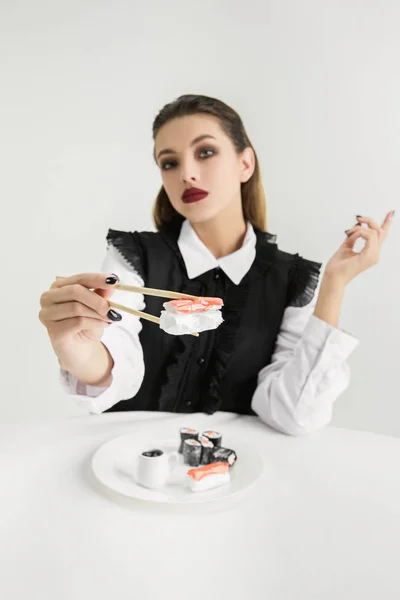 We are what we eat. Womans eating plastic food, eco concept — Stock Photo, Image