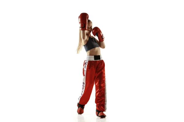 Young female kickboxing fighter training isolated on white background — Stock Photo, Image