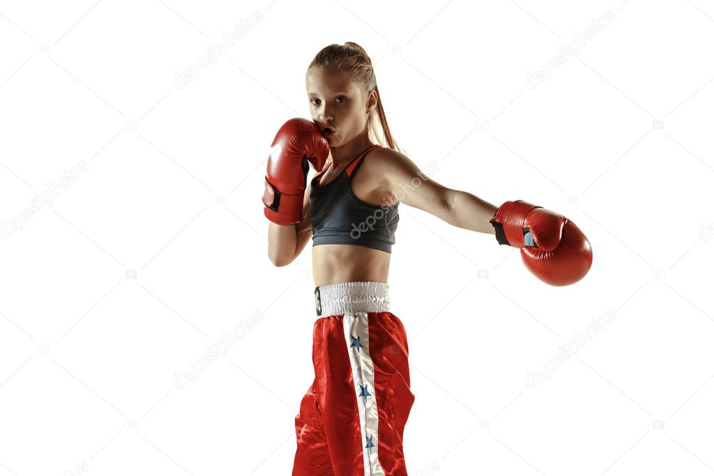 Young female kickboxing fighter training isolated on white background