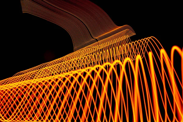 Bright neon line designed background, shot with long exposure, yellow gold