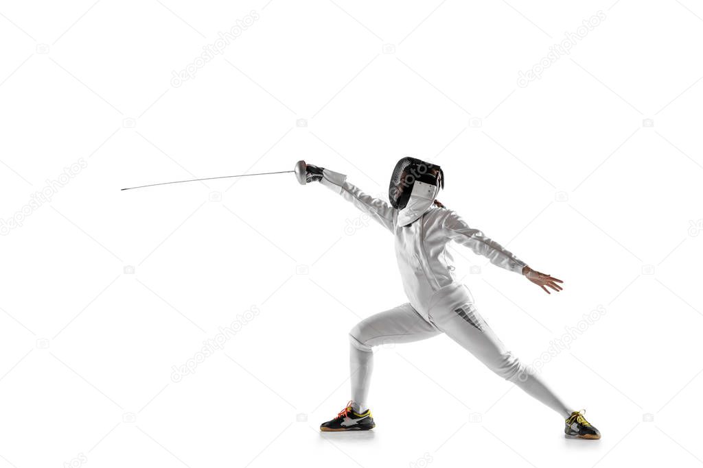 Teen girl in fencing costume with sword in hand isolated on white background