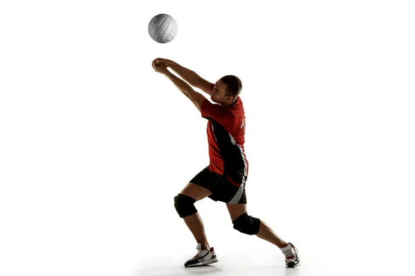 Young caucasian volleyball player placticing isolated on white background — Stock Photo, Image