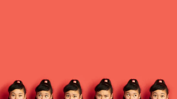 Портрет азиатских подростков на фоне красной студии — стоковое фото