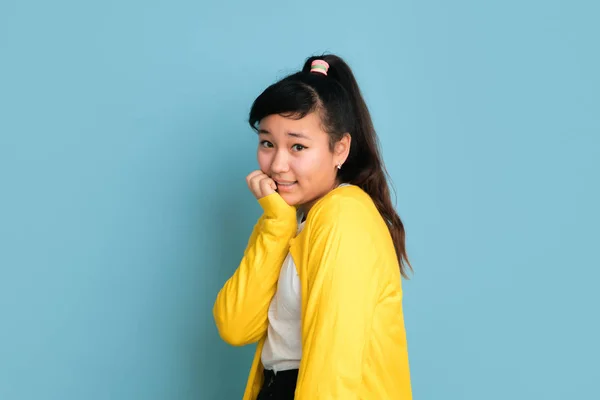 Asian teenagers portrait isolated on blue studio background — Stock Photo, Image