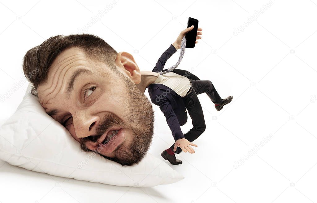 Big head on small body lying on the pillow