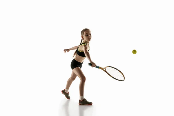 Little caucasian girl playing tennis isolated on white background — Stock Photo, Image