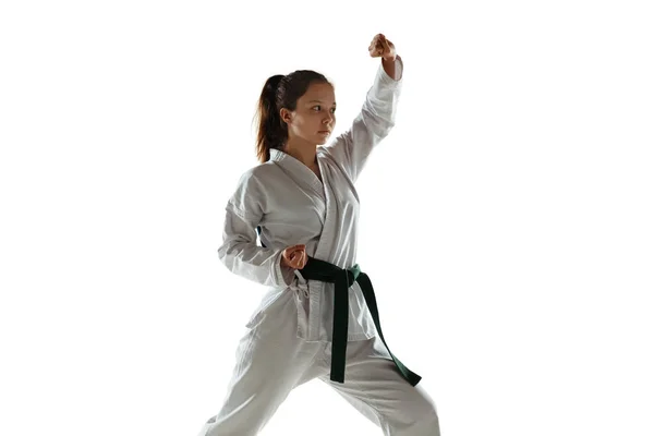 Confident junior in kimono practicing hand-to-hand combat, martial arts — Stock Photo, Image