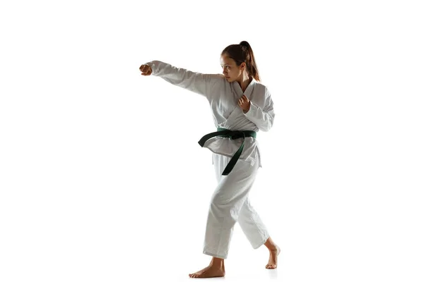 Confident junior in kimono practicing hand-to-hand combat, martial arts — Stock Photo, Image