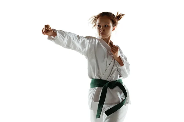 Confident junior in kimono practicing hand-to-hand combat, martial arts — Stock Photo, Image