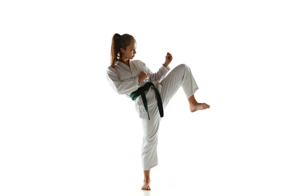 Confident junior in kimono practicing hand-to-hand combat, martial arts — Stock Photo, Image