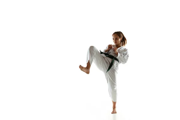 Confident junior in kimono practicing hand-to-hand combat, martial arts — Stock Photo, Image