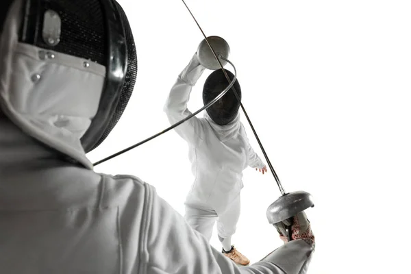 Teen girls in fencing costumes with swords in hands isolated on white background — Stock Photo, Image