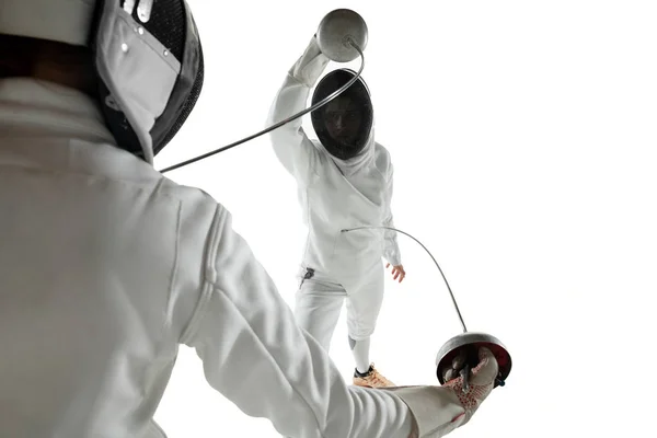 Teen girls in fencing costumes with swords in hands isolated on white background — 스톡 사진