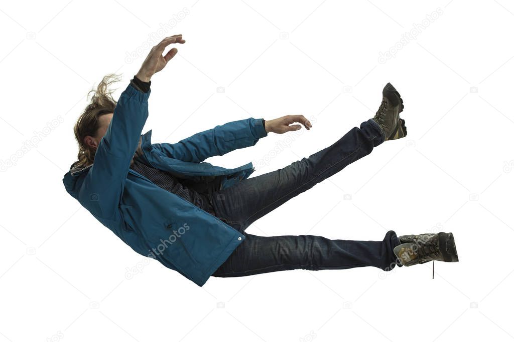A second before falling - young man falling down with bright emotions and expression