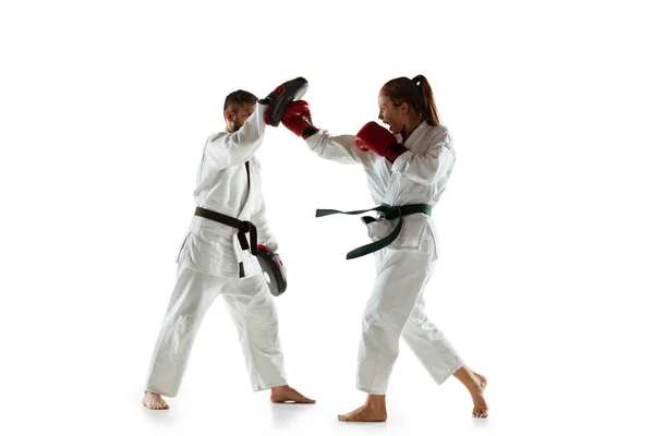 Junior in kimono practicing hand-to-hand combat with coach, martial arts — Stock Photo, Image