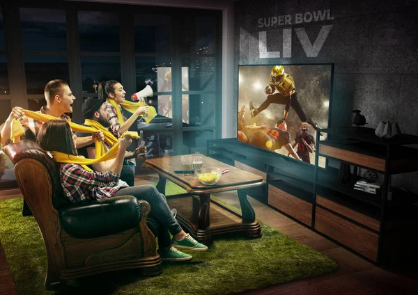 Group of friends watching TV, american football championship — Stok fotoğraf