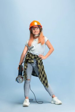 Girl dreaming about future profession of engineer
