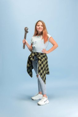 Girl dreaming about future profession of engineer