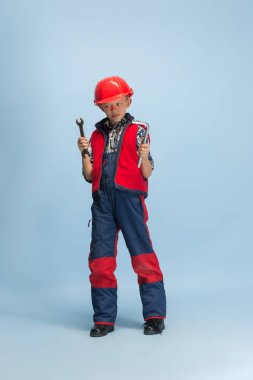 Boy dreaming about future profession of engineer