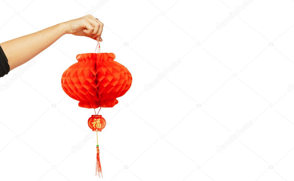 Happy Chinese New Year. Female hand holding lantern on white background