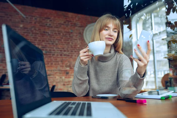 Beautiful caucasian business lady working in office with laptop