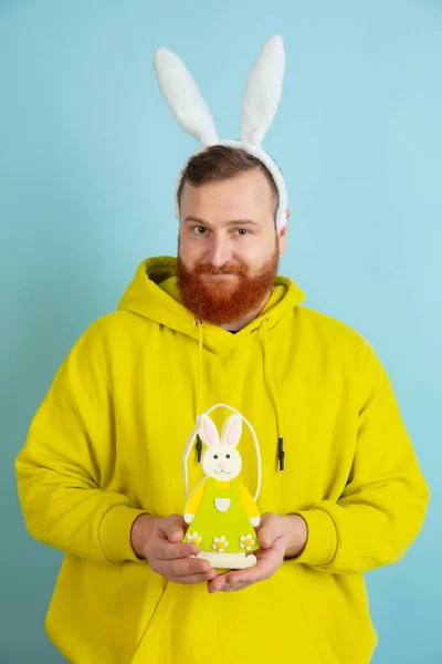 Easter bunny man with bright emotions on blue studio background — 스톡 사진