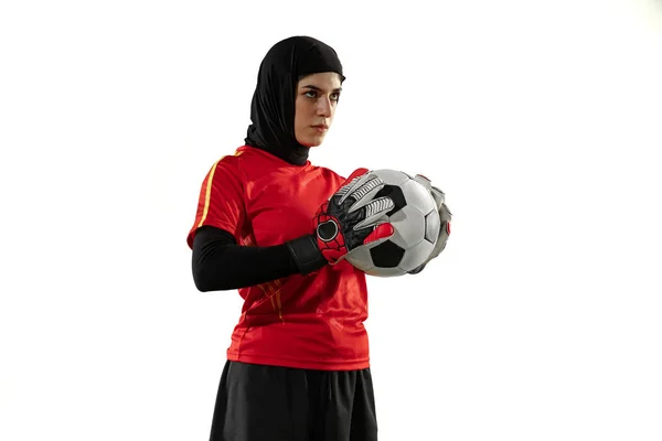 Arabian female soccer or football player, goalkeeper on white studio background — Stock Photo, Image