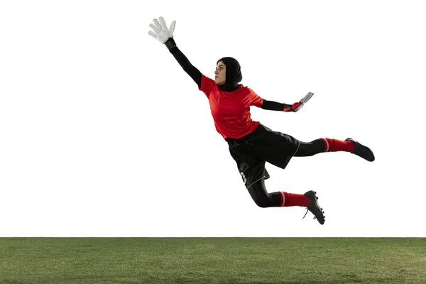 Arabian female soccer or football player, goalkeeper on white studio background — 스톡 사진