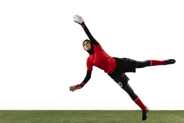 Arabian female soccer or football player, goalkeeper on white studio background — Stock Photo, Image